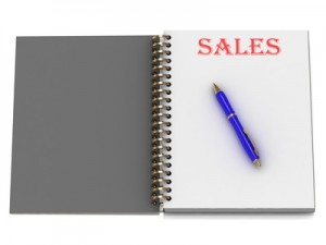 SALES word on notebook page