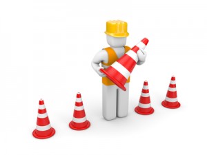 Repairman with traffic cones