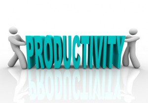 Two people push together letters to form the word Productivity
